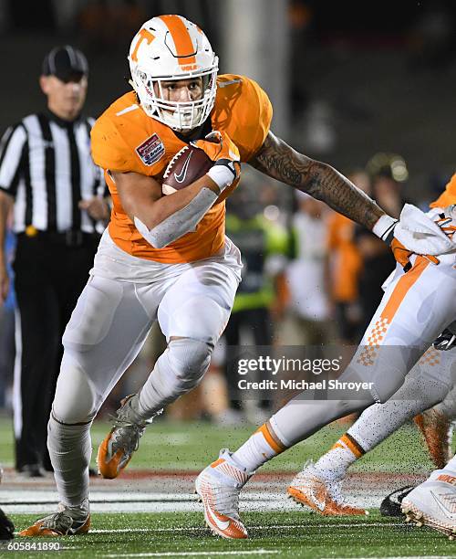 Running back Jalen Hurd of the Tennessee Volunteers carries the ball against the Virginia Tech Hokies in the first half at Bristol Motor Speedway on...