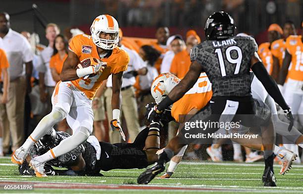 Wide receiver Josh Malone of the Tennessee Volunteers carries the ball following his reception against the Virginia Tech Hokies in the first half at...