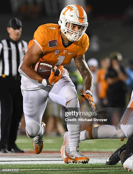 Running back Jalen Hurd of the Tennessee Volunteers carries the ball against the Virginia Tech Hokies in the first half at Bristol Motor Speedway on...