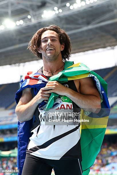 Liam Malone of New Zealand celebrates after winning the Men's 400m T44 final and setting a new world record of 46.20 seconds on day 8 of the Rio 2016...