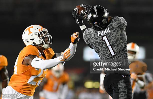 Wide receiver Isaiah Ford of the Virginia Tech Hokies is defended by Defensive back Cameron Sutton of the Tennessee Volunteers in the first half at...