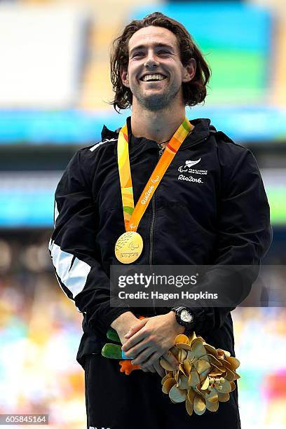 Liam Malone of New Zealand celebrates after winning gold in the Men's 400m T44 final and setting a new world record of 46.20 seconds in the process...
