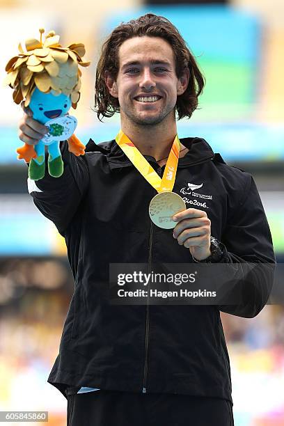 Liam Malone of New Zealand poses after winning gold in the Men's 400m T44 final and setting a new world record of 46.20 seconds in the process on day...