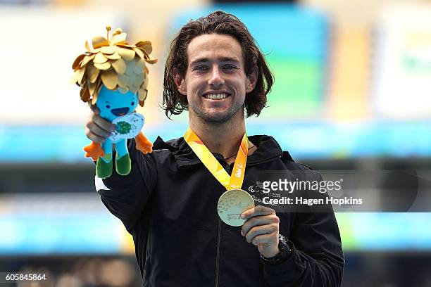 Liam Malone of New Zealand poses after winning gold in the Men's 400m T44 final and setting a new world record of 46.20 seconds in the process on day...
