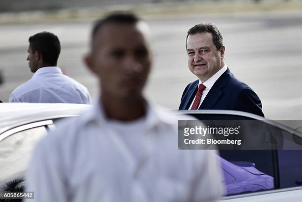 Ivica Dacic, Serbia's foreign minister, right, arrives at the Santiago Marino Caribbean International Airport during the the Non-Aligned Movement...