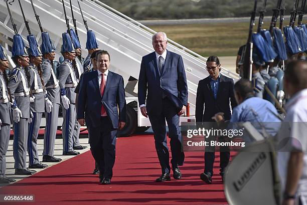 Ivica Dacic, Serbia's foreign minister, left, arrives at the Santiago Marino Caribbean International Airport during the the Non-Aligned Movement...