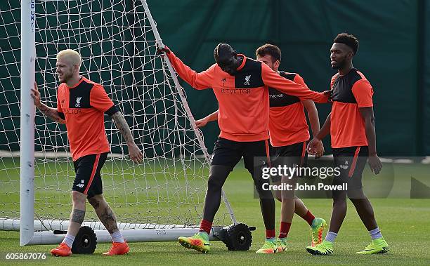 Alberto Moreno, Mamadou Sakho and Daniel Sturridge of Liverpool during a training session at Melwood Training Ground on September 15, 2016 in...