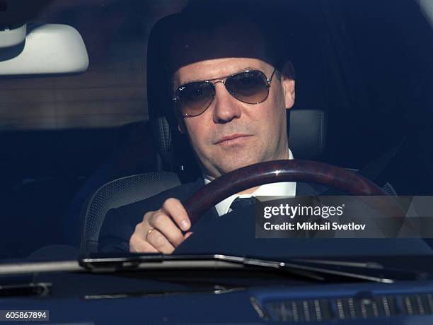 Russian Prime Minister Dmitry Medvedev drives a Mercedes GL while visiting a constructing site of the Kerch Strait Bridge, on September 15, 2016 in...