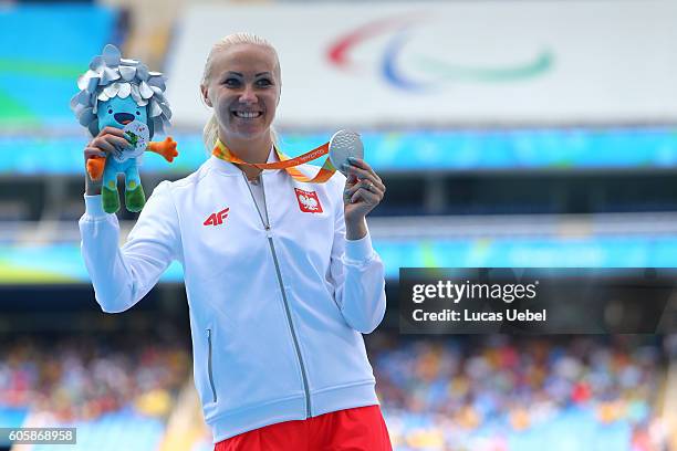 Silver medalist Karolina Kucharczyk of Poland poses on the podium at the medal ceremony for Women's Long Jump - T20 during day 8 of the Rio 2016...