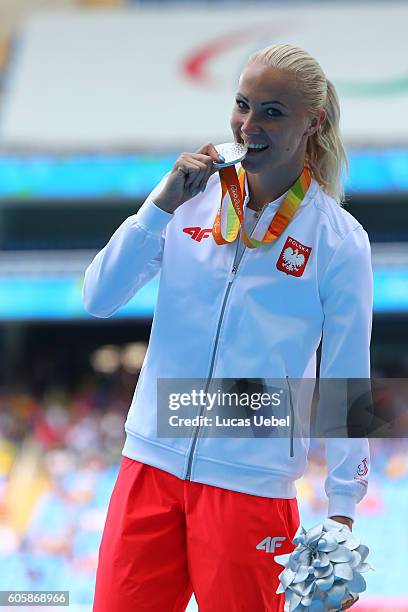 Silver medalist Karolina Kucharczyk of Poland poses on the podium at the medal ceremony for Women's Long Jump - T20 during day 8 of the Rio 2016...