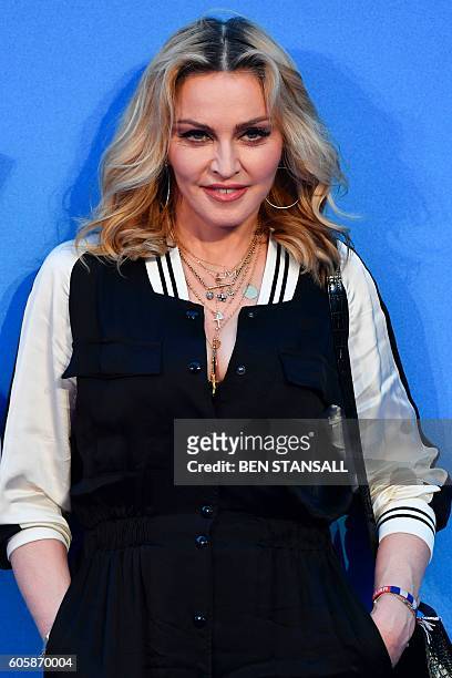 Singer-songwriter Madonna poses arriving on the carpet to attend a special screening of the film "The Beatles Eight Days A Week: The Touring Years"...