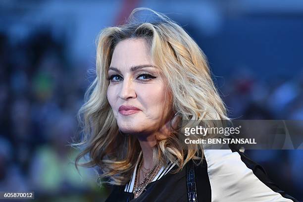 Singer-songwriter Madonna poses arriving on the carpet to attend a special screening of the film "The Beatles Eight Days A Week: The Touring Years"...