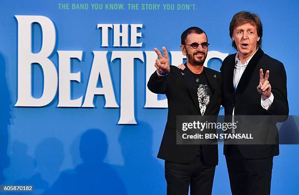 British singer-songwriter Paul McCartney and muscian Ringo Starr of legendary rock-band The Beatles pose arriving on the carpet to attend a special...