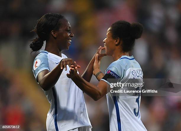 Danielle Carter of England is congratulated on scoring her second goal by Demi Stokes during the UEFA Women's Euro 2017 Qualifier between England and...