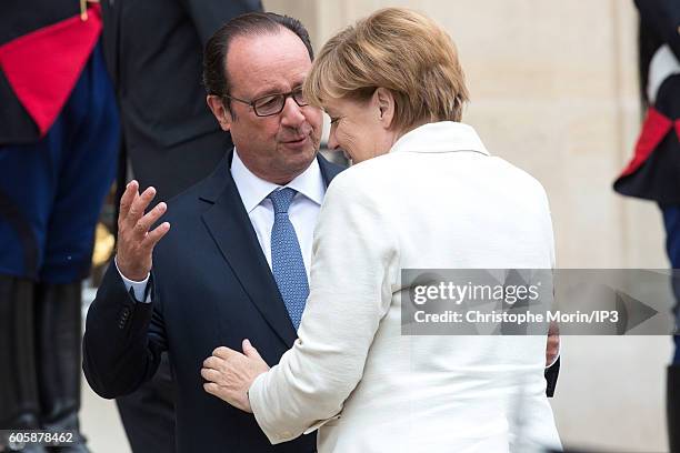 French President Francois Hollande receives German Federal Chancellor Angela Merkel for a meeting followed by a working lunch, in connection with the...