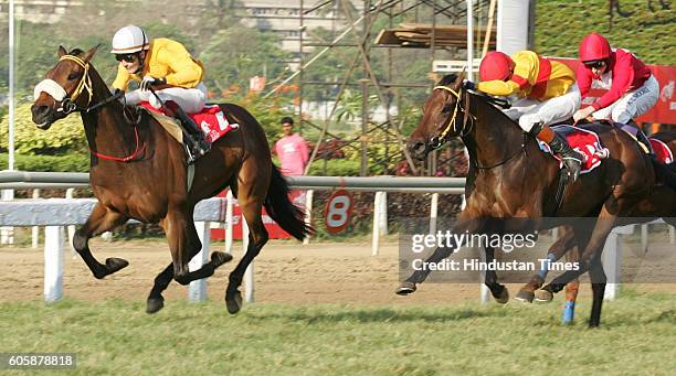 Jockey Colm O'Donoghue with the horse Bourbon King passing the finishing line ahead of other horses at the Poonawala Breeders' Multi-Million race at...