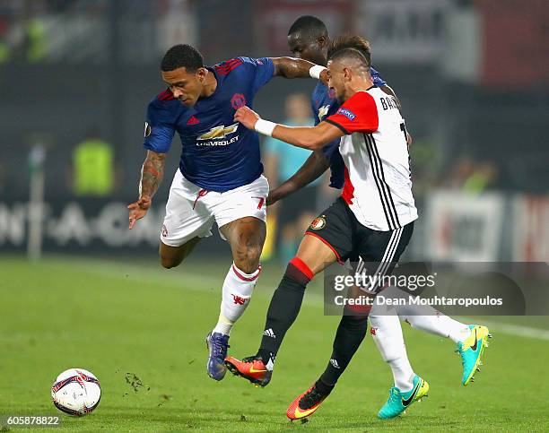 Memphis Depay of Manchester United and Bilal Basacikoglu of Feyenoord battle for the ball during the UEFA Europa League Group A match between...