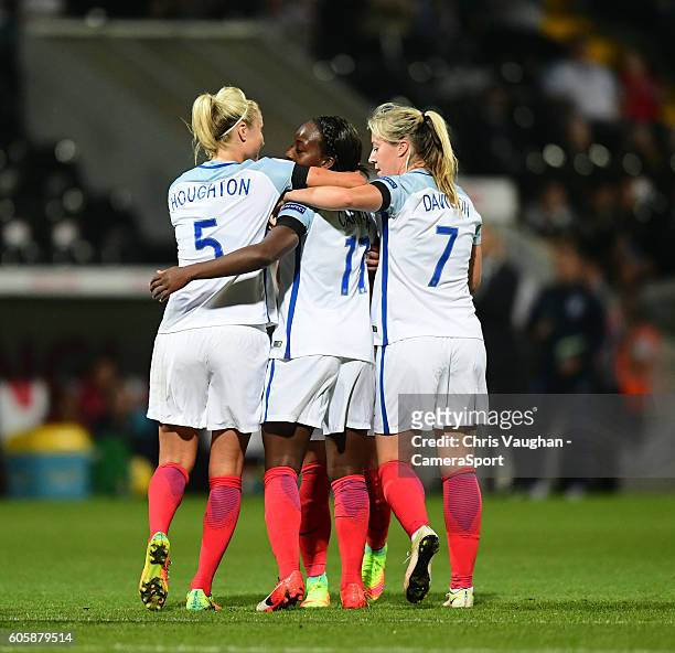 England women's Danielle Carter, centre, celebrates completing her hat-trick after scoring his sides fourth goal with team-mates Steph Houghton,...