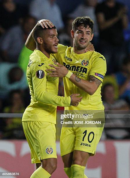 Villarreal's Mexican midfielder Jonathan dos Santos celebrates with Villarreal's Brazilian forward Alexandre Rodrigues "Pato" after scoring during...