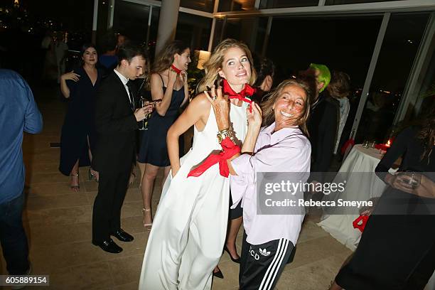 Doutzen Kroes and Carylne Cerf de Dudzeele tie on bandannas at the launch of #KnotOnMyPlanet to benefit the Elephant Crisis Fund, at the Standard...