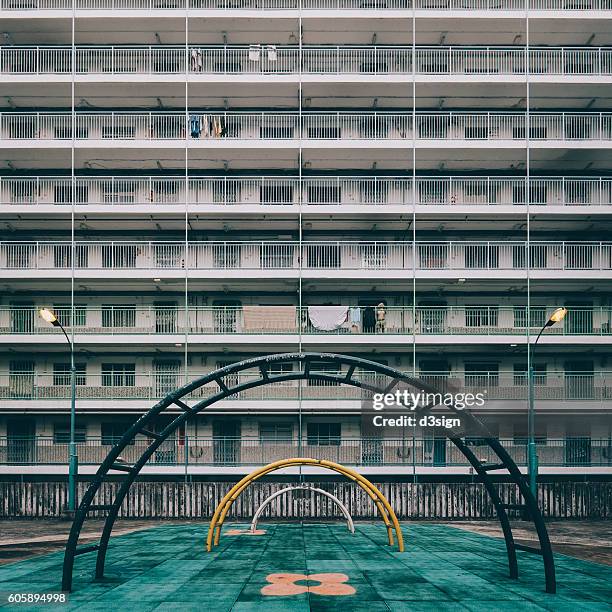 old styled playground with public housing estates in hong kong. - sport community center stock pictures, royalty-free photos & images