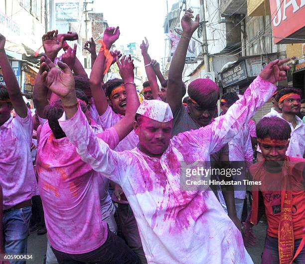 Hindu devotees shouting religious slogans during a procession for the immersion of idols of elephant-headed Hindu God Ganesha in the River Tawi on...