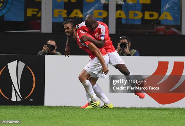 Miguel Vitor of Hapoel Beer-Sheva FC celebrates his first goal with Anthony NwaKaeme during the UEFA Europa League match between FC Internazionale...