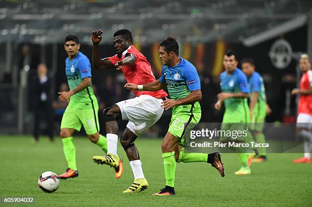 John Ogu of Hapoel Beer-Sheva FC competes for the ball with Eder of FC Internazionale during the UEFA Europa League match between FC Internazionale...