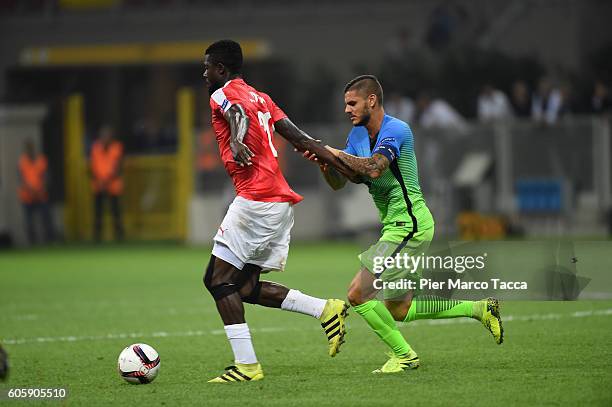 John Ogu of Hapoel Beer-Sheva FC competes for the ball with Mauro Icardi of FC Internazionale during the UEFA Europa League match between FC...