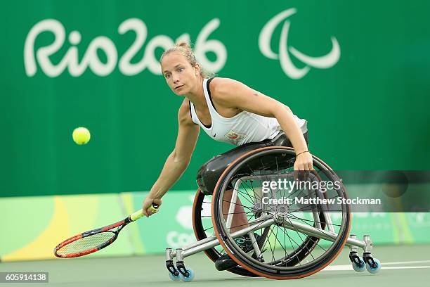 Jiske Griffioen of the Netherlands returns a shot to Aniek van Koot while playing in women's singles gold medal match at the Olympic Tennis Center...