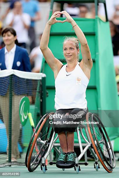 Jiske Griffioen of the Netherlands celebrates her win over Aniek van Koot in the women's singles gold medal match at the Olympic Tennis Center during...