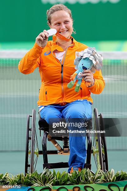 Aniek van Koot of the Netherlands is presented the silver medal in the women's singles at the Olympic Tennis Center during day 8 of the Rio 2016...