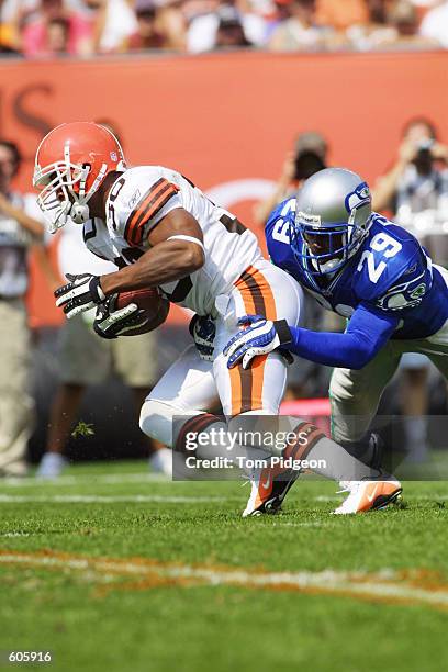 Running back Jamel White of the Cleveland Browns is tackled by defender Curtis Fuller of the Seattle Seahawks at Cleveland Browns Stadium in...