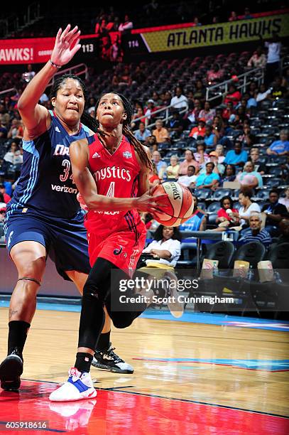 Tayler Hill of the Washington Mystics handles the ball against Markeisha Gatling of the Atlanta Dream on September 15, 2016 at Philips Arena in...