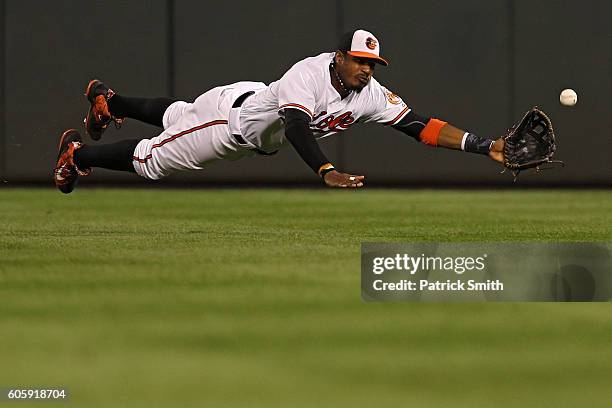 Adam Jones of the Baltimore Orioles cannot make a catch on an RBI double hit by Steven Souza Jr. #20 of the Tampa Bay Rays during the third inning at...