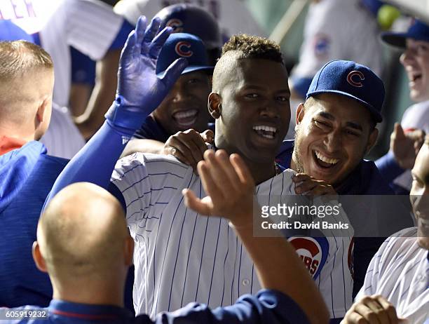 Jorge Soler of the Chicago Cubs is greeted by teammates after hitting a two-run homer against the Milwaukee Brewers during the second inning on...