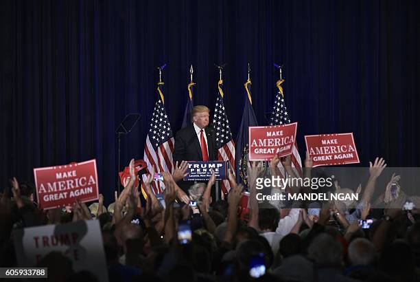 Republican presidential nominee Donald Trump speaks during a rally at Laconia Middle School on September 15, 2016 in Laconia, New Hampshire. / AFP /...