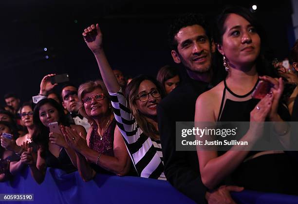 Attendees look on as democratic presidential nominee former Secretary of State Hillary Clinton speaks during the Congressional Hispanic Caucus...