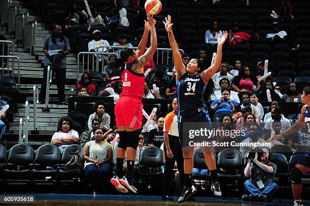 Kia Vaughn of the Washington Mystics shoots the ball against Markeisha Gatling of the Atlanta Dream on September 15, 2016 at Philips Arena in...