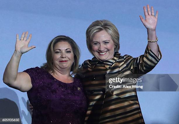 Democratic presidential nominee Hillary Clinton and U.S. Rep. Linda Sanchez wave on stage during the 39th annual awards gala of the Congressional...