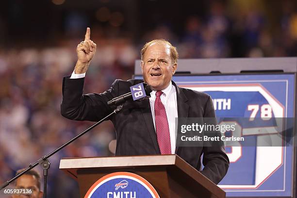 Commentator Chris Berman introduces Hall of Famer Bruce Smith during the game between the New York Jets and Buffalo Bills at New Era Field on...