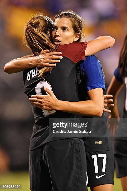 Tobin Heath of the US Women's National Team celebrates with Heather O'Reilly of the US Women's National Team after scoring a goal in the first half...