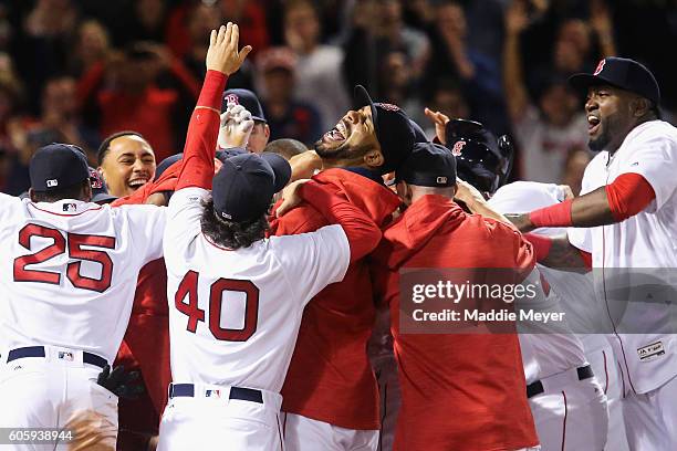 David Price of the Boston Red Sox, center, and David Price, right, celebrate with Hanley Ramirez as he crosses home plate after hitting the game...