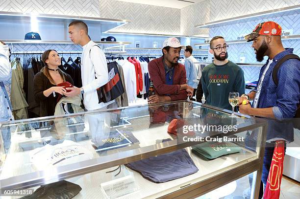 Guests attend the opening of KITH presented by Ronnie Fieg & New York Magazine's Diana Tsui at Goodman's Men's Store at Bergdorf Goodman Men's Store...