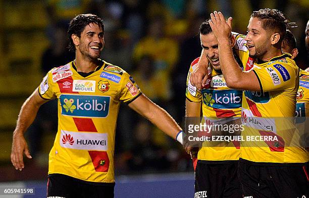 Costa Rica's Herediano Pablo Salazar , Yendrick Ruiz and Elias Aguilar celebrate a goal again Panama's Plaza Amador during the CONCACAF Champions...