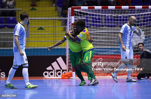 Jeffery Bule of the Solomon Islands and teammate Coleman Makau celebrate Makau's goal as Alan Brandi, Damian Stazzone and goalkeeper Nicolas...