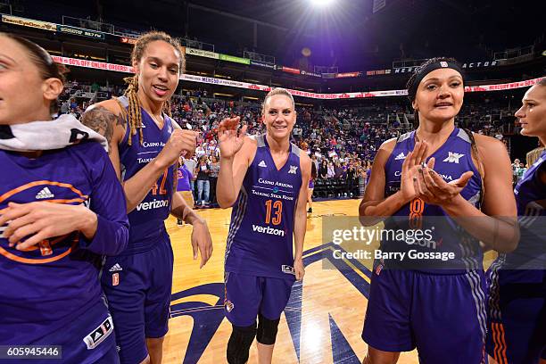 Penny Taylor of the Phoenix Mercury , Brittney Griner of the Phoenix Mercury and Mistie Bass of the Phoenix Mercury are seen during the game against...