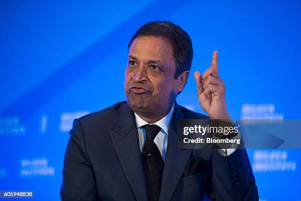 Binod Chaudhary, president of Chaudhary Group, gestures as he speaks at the Milken Institute Asia Summit in Singapore, on Friday, Sept. 16, 2016....