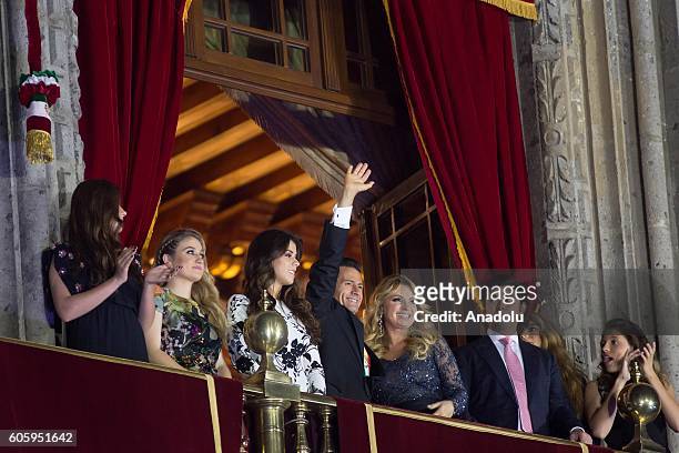 Mexican President Enrique Pena Nieto and his family are seen during the traditional "El Grito" or "The Shout" at the balcony of the National Palace,...