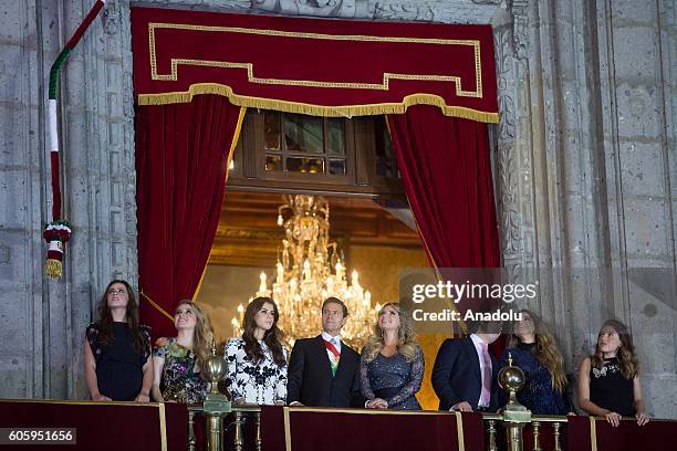 Mexican President Enrique Pena Nieto and his family are seen during the traditional "El Grito" or "The Shout" at the balcony of the National Palace,...